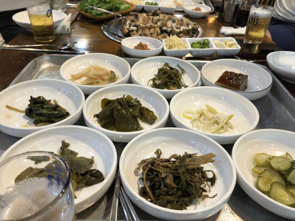 Traditional Korean side dishes arranged on dining table