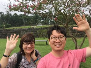 Foreigner and Korean posing in Jeju island