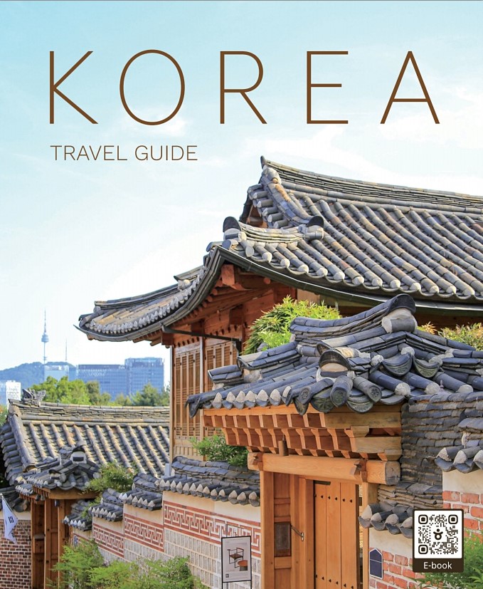 Korea Travel Guide cover with traditional Korean hanok roof and Namsan Tower in the background
